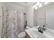 Bathroom with a shower curtain, a white sink and vanity, and light fixtures at 155 Chimney Rise Dr, Cary, NC 27511