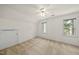 Bedroom featuring a ceiling fan, carpet, two windows, and a closet at 155 Chimney Rise Dr, Cary, NC 27511