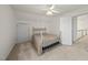 Bedroom with a metal bed frame, carpet, a ceiling fan, and a window at 155 Chimney Rise Dr, Cary, NC 27511