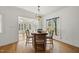 A dining area features a table with seating near a sunroom at 155 Chimney Rise Dr, Cary, NC 27511