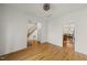 Open dining room featuring hardwood floors, white trim, and views to the staircase at 155 Chimney Rise Dr, Cary, NC 27511