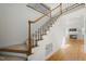 Bright foyer featuring hardwood floors, a staircase, and views of the living room at 155 Chimney Rise Dr, Cary, NC 27511