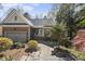 Charming home featuring brick facade, attached garage, and a cozy porch with rocking chairs at 155 Chimney Rise Dr, Cary, NC 27511