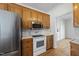 View of a kitchen featuring oak cabinets, white countertops, and stainless steel appliances at 155 Chimney Rise Dr, Cary, NC 27511