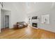 A bright living room features hardwood floors, fireplace, and natural light at 155 Chimney Rise Dr, Cary, NC 27511