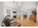 A living room features a fireplace, hardwood floors, and natural light at 155 Chimney Rise Dr, Cary, NC 27511