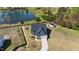 Aerial view of home and community featuring a serene pond and lush landscaping at 16 Blue Monarch Ln, Fuquay Varina, NC 27526