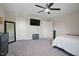 Stylish bedroom offers a relaxing space with natural light, a ceiling fan, and a neutral color palette at 16 Blue Monarch Ln, Fuquay Varina, NC 27526