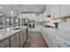 Well-appointed kitchen featuring stainless steel appliances, a gas cooktop, and ample counter space for meal preparation at 16 Blue Monarch Ln, Fuquay Varina, NC 27526
