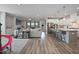 Open-concept living space seamlessly connects the kitchen, living room, and dining area, perfect for gatherings at 16 Blue Monarch Ln, Fuquay Varina, NC 27526