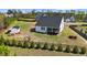 Aerial view of backyard featuring fenced yard and outbuilding at 16 Blue Monarch Ln, Fuquay Varina, NC 27526