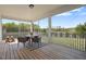 Relaxing screened porch with outdoor dining set, perfect for enjoying the views of the yard at 16 Blue Monarch Ln, Fuquay Varina, NC 27526