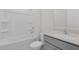 Bright bathroom featuring a shower-tub combo and single sink vanity at 163 Fair Child Rd, Spring Lake, NC 28390