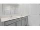 This bathroom has a large mirror and double sinks with gray cabinets at 163 Fair Child Rd, Spring Lake, NC 28390
