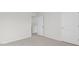 This bedroom has neutral walls, light carpeting, and white doors at 163 Fair Child Rd, Spring Lake, NC 28390