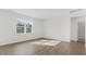 Bedroom featuring wood-look floors, a window, and an ensuite bathroom at 163 Fair Child Rd, Spring Lake, NC 28390