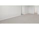 This bedroom has neutral walls, light carpeting, and white doors at 163 Fair Child Rd, Spring Lake, NC 28390