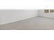 Spacious bedroom with neutral carpet, base trim, a window, and white walls at 163 Fair Child Rd, Spring Lake, NC 28390