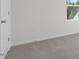 Bright bedroom featuring neutral carpet, base trim, and natural light from a window at 163 Fair Child Rd, Spring Lake, NC 28390