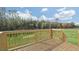 Wooden deck with railing offers scenic views of the backyard and surrounding greenery at 163 Fair Child Rd, Spring Lake, NC 28390