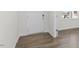 Modern entryway with durable hardwood flooring and a bright white front door at 163 Fair Child Rd, Spring Lake, NC 28390