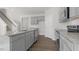 Modern kitchen featuring gray cabinets, stainless steel appliances, and granite countertops at 163 Fair Child Rd, Spring Lake, NC 28390
