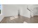 Inviting living room with wood-look floors and staircase with natural light at 163 Fair Child Rd, Spring Lake, NC 28390