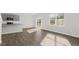 Spacious living room, featuring natural lighting and hardwood floors at 163 Fair Child Rd, Spring Lake, NC 28390