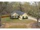 Aerial view showcases the home and large front yard at 1638 Crystal Ln, Stem, NC 27581