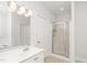 Bathroom features a standing shower, vanity, and plenty of light at 1638 Crystal Ln, Stem, NC 27581