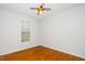Neutral bedroom with hardwood floors and a ceiling fan, offering a cozy atmosphere at 1638 Crystal Ln, Stem, NC 27581