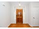 Inviting entryway with a beautiful wood door and sidelights leading into the home at 1638 Crystal Ln, Stem, NC 27581