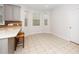 Bright eating area with natural light, tile floors, and seating for two at 1638 Crystal Ln, Stem, NC 27581
