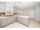 Bright kitchen features gray cabinets, modern countertops, and backsplash design at 1638 Crystal Ln, Stem, NC 27581
