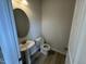 Half bath featuring stylish pedestal sink and fixtures at 168 Bruce Dr, Dunn, NC 28334