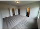 Spacious bedroom featuring neutral carpet, two closets, and a connecting bathroom for added convenience at 168 Bruce Dr, Dunn, NC 28334