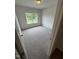 A well lit bedroom featuring carpet floors and large window looking out to the backyard at 168 Bruce Dr, Dunn, NC 28334