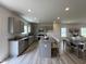 Modern kitchen with stainless steel appliances, granite countertops, and a functional island at 168 Bruce Dr, Dunn, NC 28334