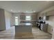 Modern kitchen featuring stainless steel appliances, a center island, and ample counter space at 168 Bruce Dr, Dunn, NC 28334