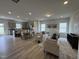 Bright open-concept living space with natural light, wood flooring, and modern decor at 168 Bruce Dr, Dunn, NC 28334