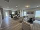 Spacious living room featuring modern decor, wood flooring, and lots of natural light at 168 Bruce Dr, Dunn, NC 28334