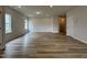 Empty living room with wood floor, recessed lights, and large windows at 168 Bruce Dr, Dunn, NC 28334