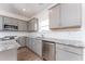 Modern kitchen with stainless steel appliances, granite countertops, and subway tile backsplash at 168 Bruce Dr, Dunn, NC 28334