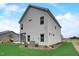 Charming two-story home featuring a screened-in porch and lush green lawn at 176 Bruce Dr, Dunn, NC 28334