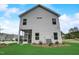 Exterior view of house with screened porch and lush lawn at 176 Bruce Dr, Dunn, NC 28334