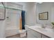 Clean bathroom featuring a tub-shower combo, a vanity with storage, and a modern shower curtain at 176 Bruce Dr, Dunn, NC 28334