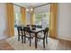 Inviting dining area filled with natural light and featuring a dining table and yellow curtains at 176 Bruce Dr, Dunn, NC 28334