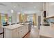 Spacious kitchen island with sink, dishwasher, and a view into the living and dining spaces at 176 Bruce Dr, Dunn, NC 28334