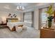Elegant main bedroom with tray ceiling, stylish lighting, and coordinated decor at 176 Bruce Dr, Dunn, NC 28334