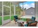 Relaxing screened porch with outdoor seating and views of the backyard at 176 Bruce Dr, Dunn, NC 28334
